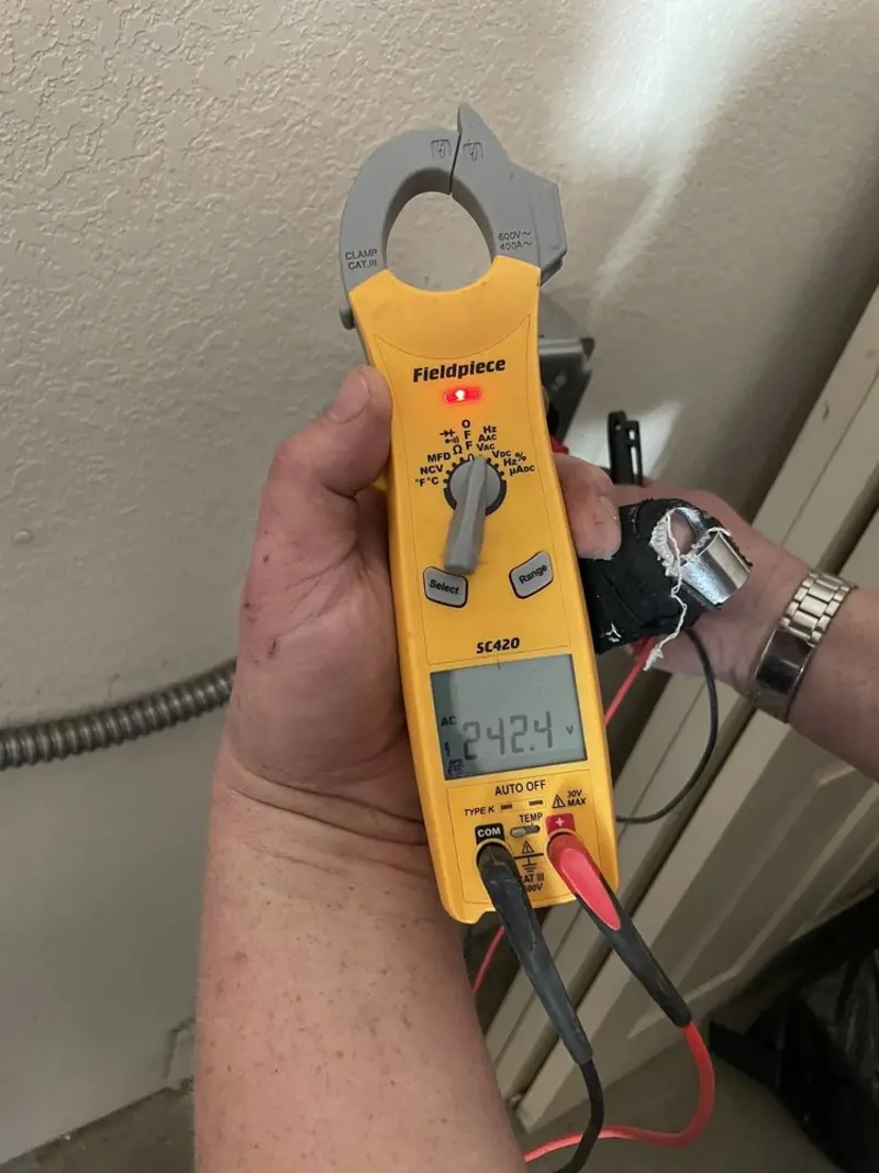 Voltage testing with clamp meter during Outlet Installation in Beaufort